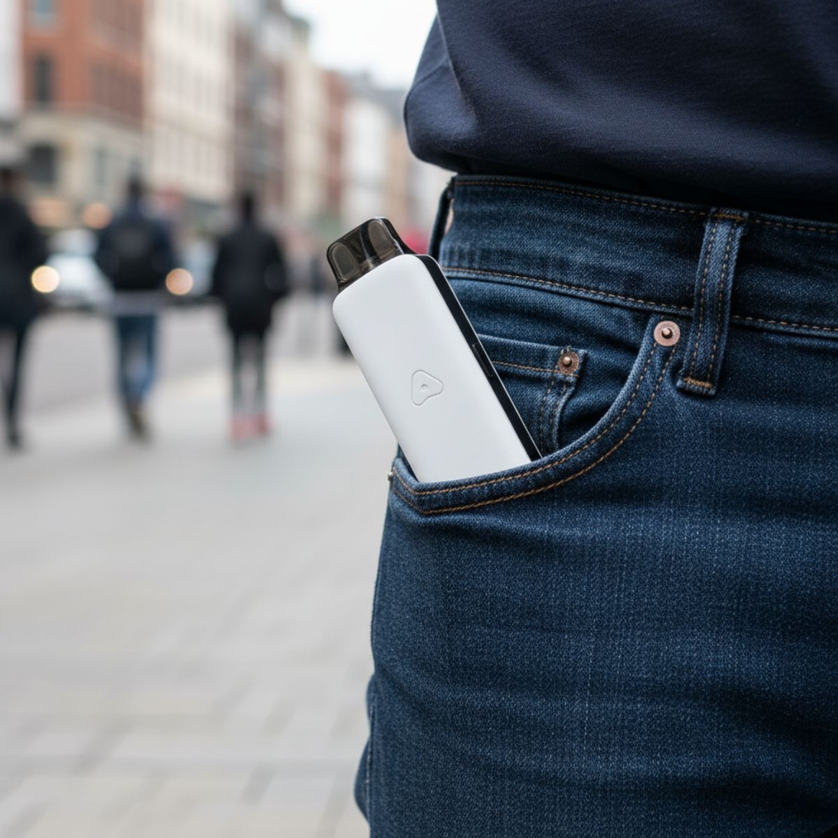 Matte White AirsPops Pro II in a jean pocket on a street