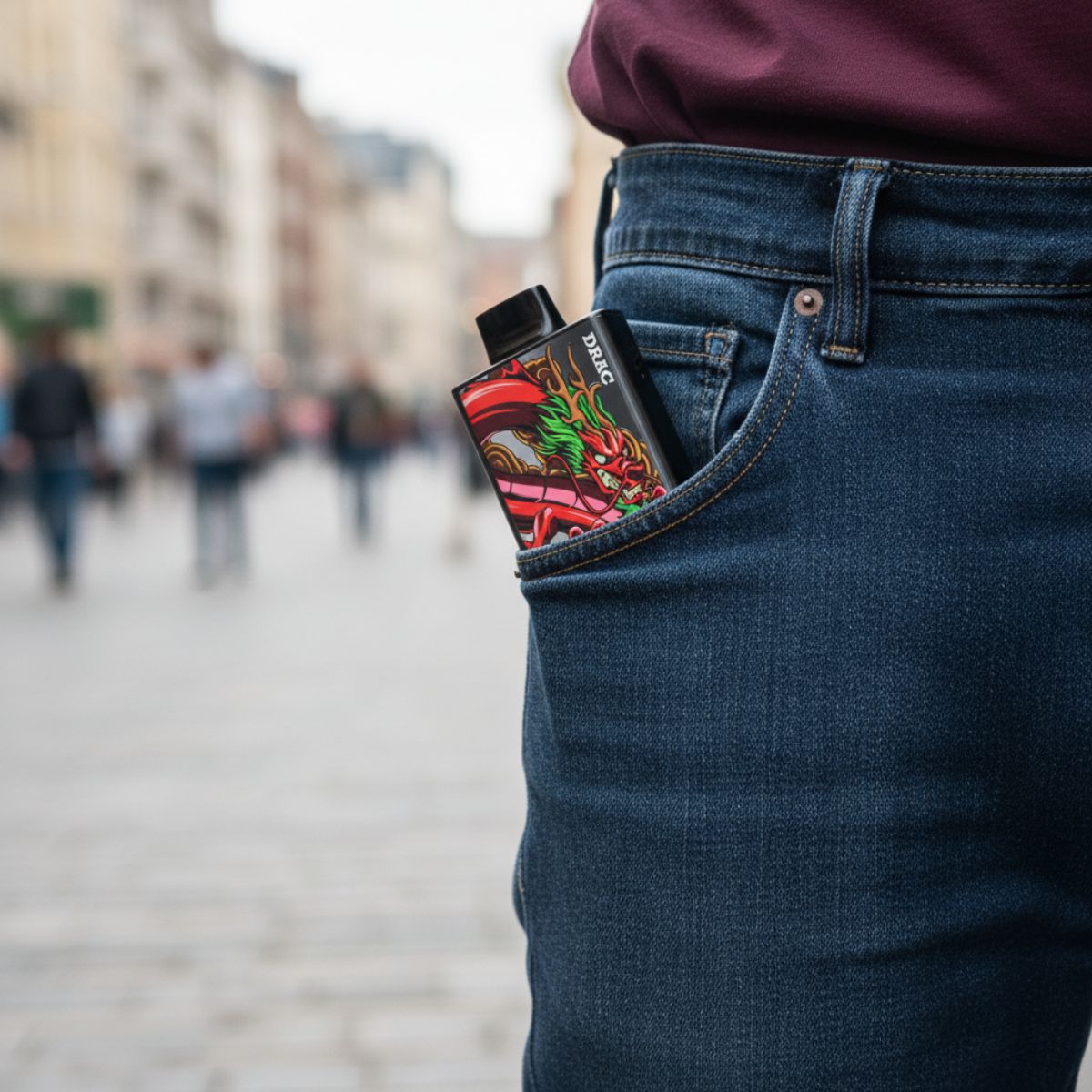 Nasty Bar Dragon 25k disposable vape in a jean pocket on a busy street