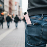Rosy Pink AirsPops Pro LITE in back pocket of jeans on a street