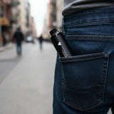 Stealth Black AirsPops XL Device in the back pocket of a mans jean pants on a street